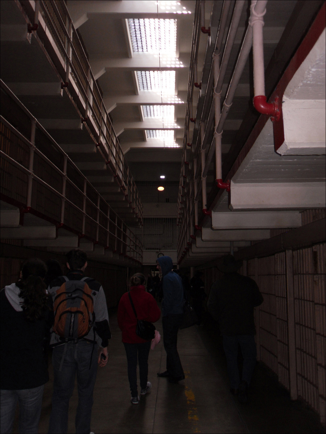 (L-R) Walking through the cellblock Katherine, Judith, Micah, and Bob