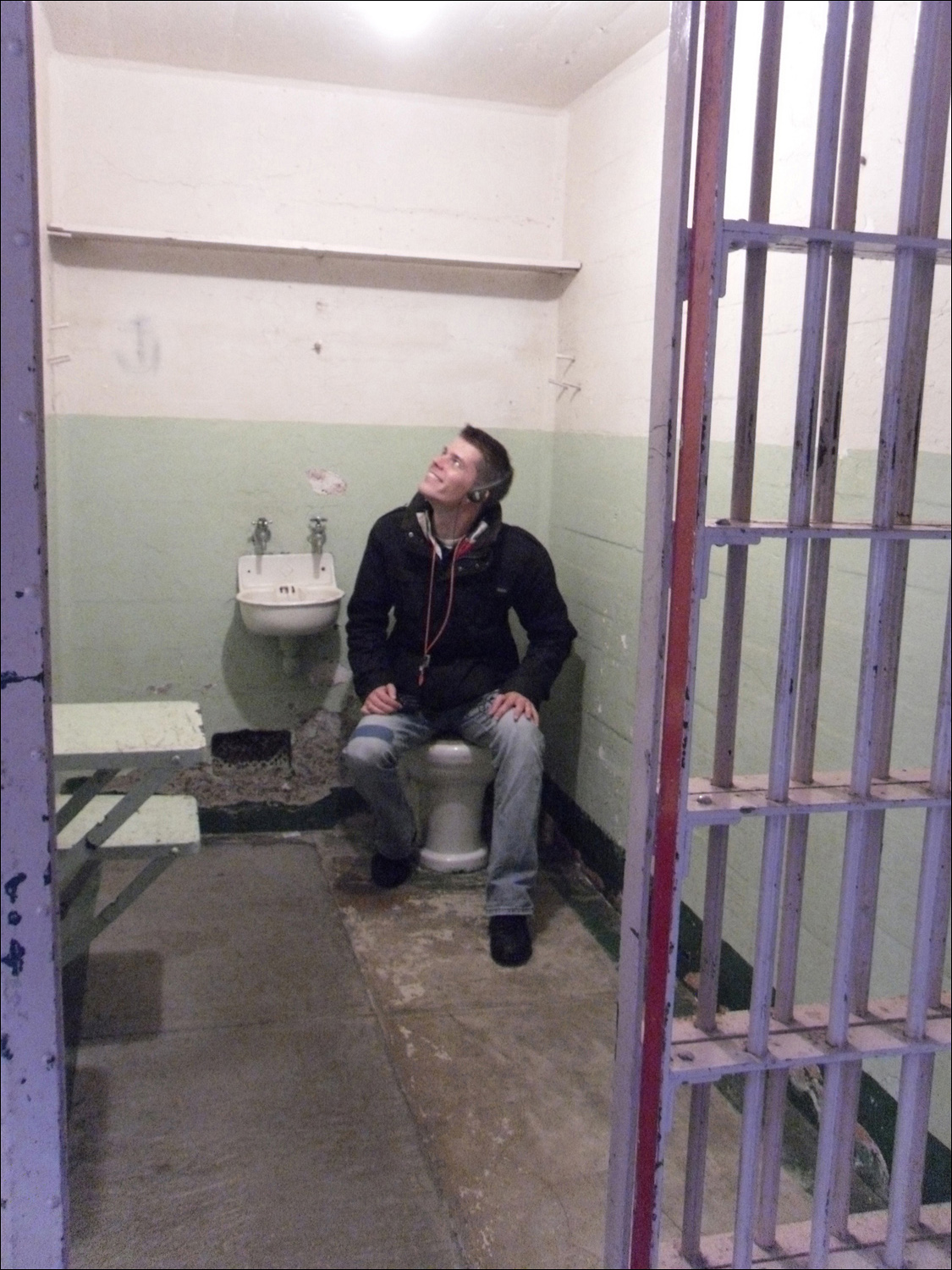 Andre posing in cell