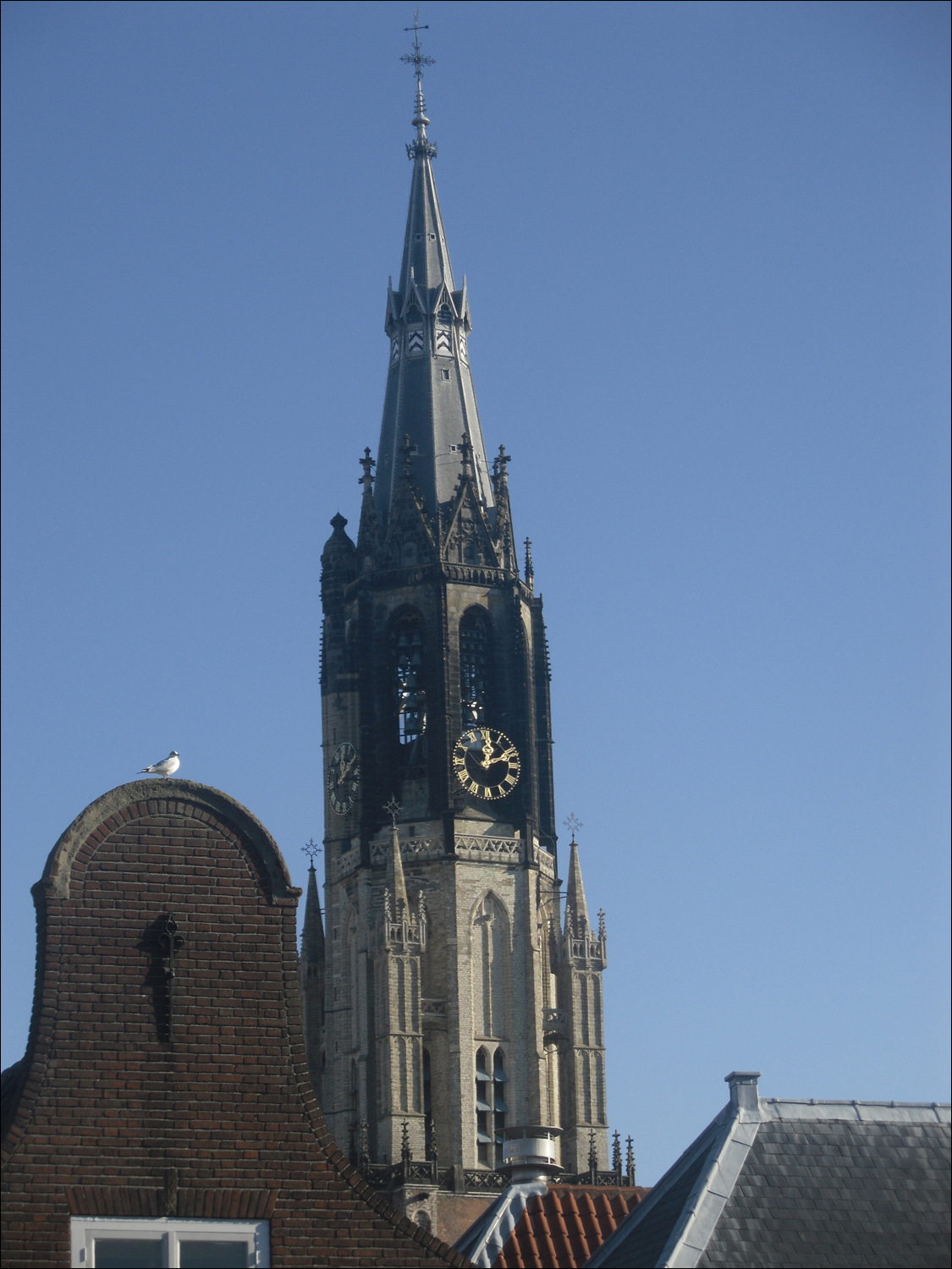 Clock tower of Nieuwe Kerk as seen from Delft house