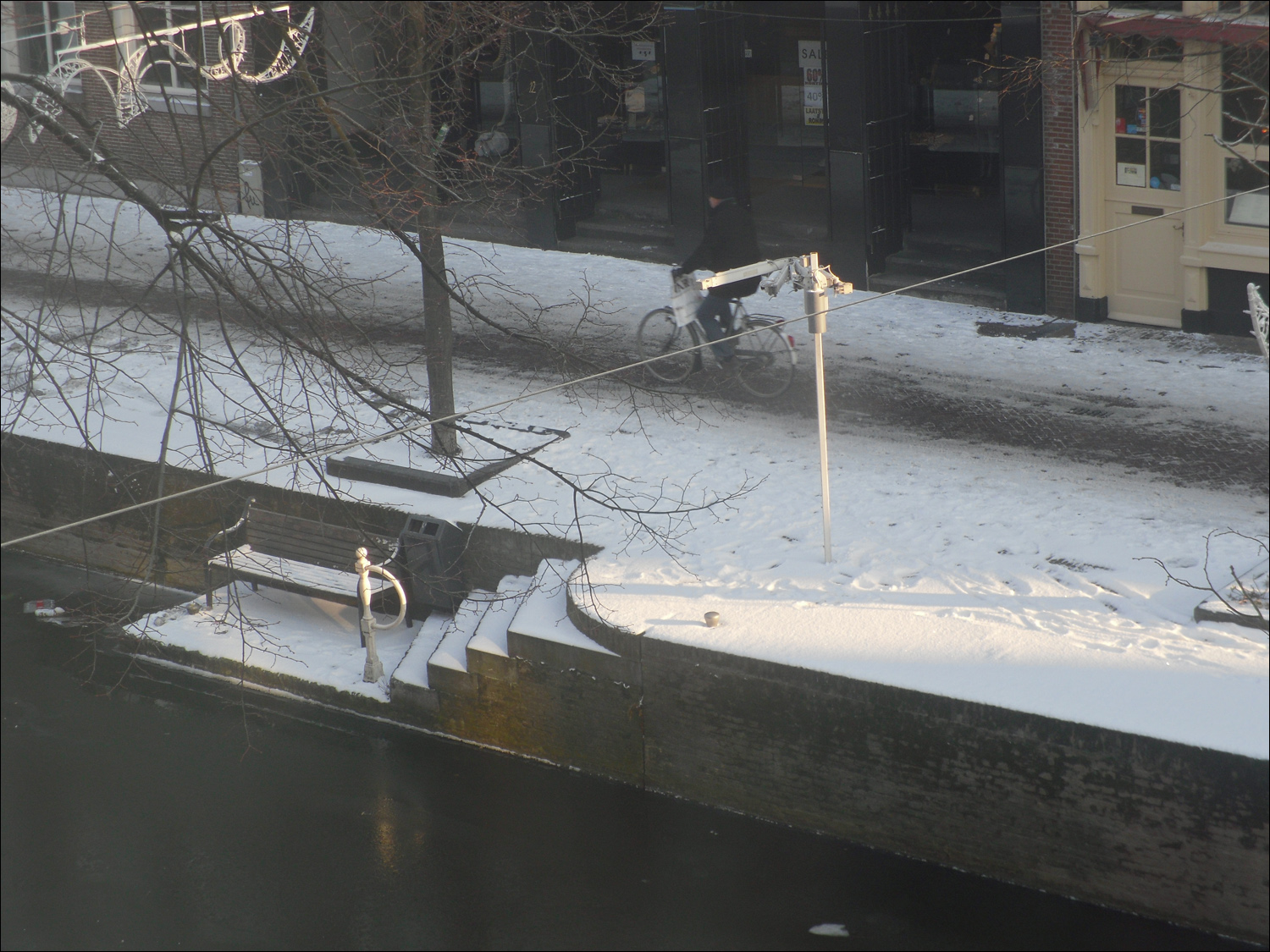 View of Hippolytusbuurt st canal from our dining room following snowfall-this is a water taxi stop