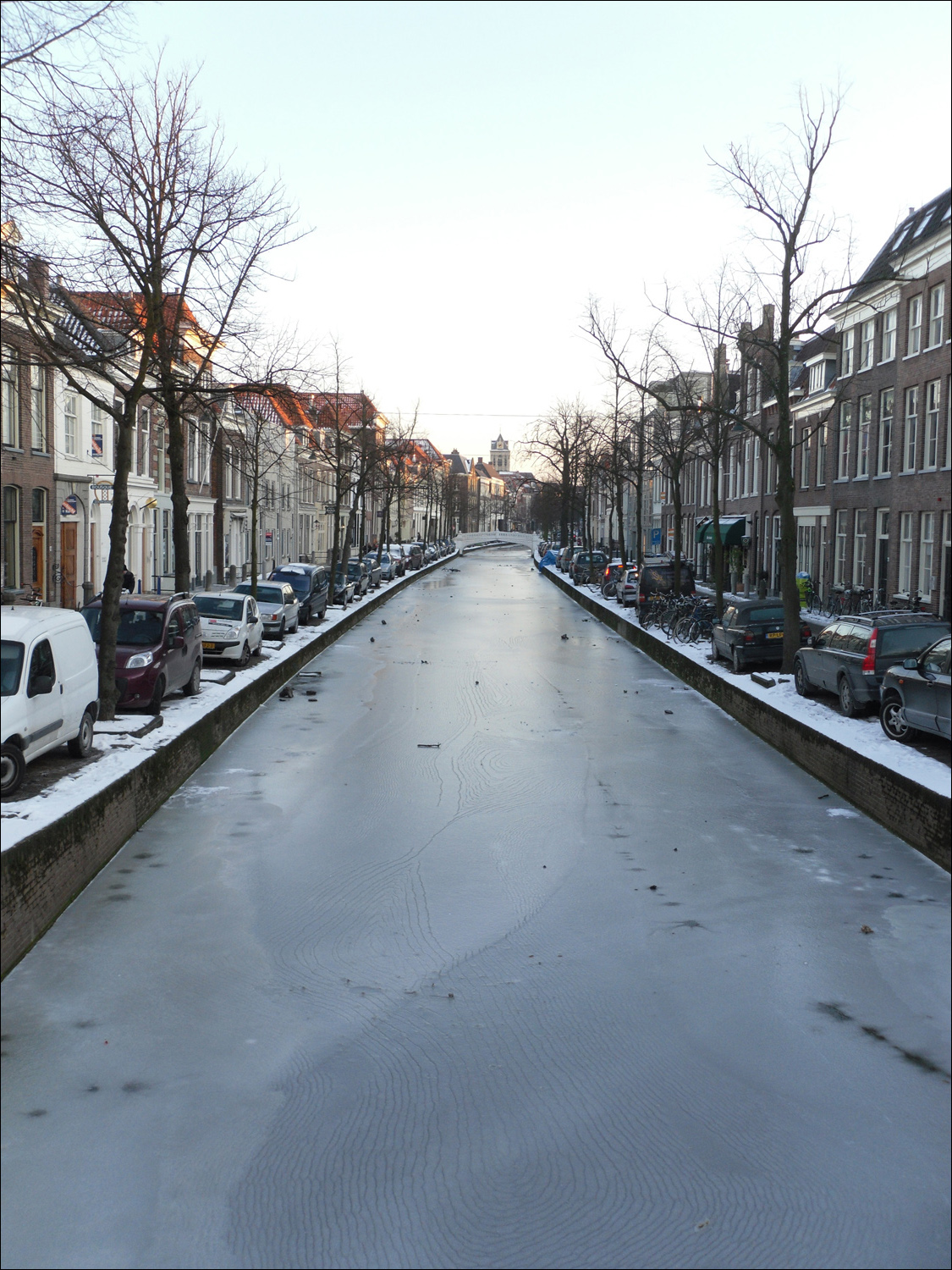 Delft-typical canal/street (frozen), note there are no guards to prevent cars from driving into canal by accident